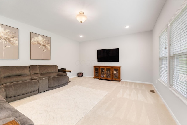 living area with carpet floors, baseboards, and recessed lighting
