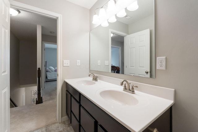 ensuite bathroom featuring double vanity