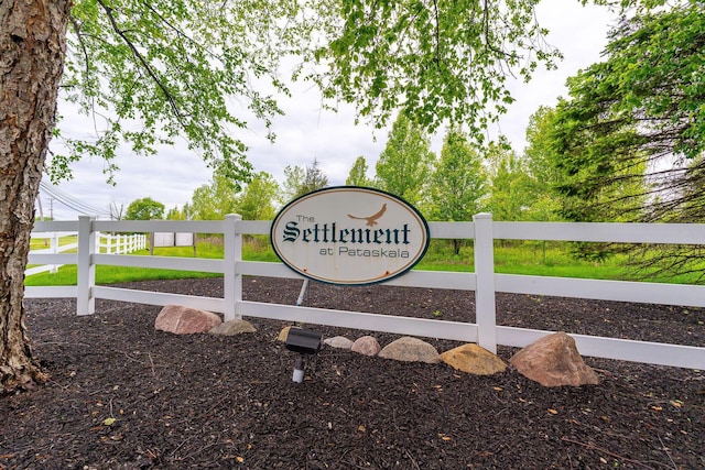 community sign with fence