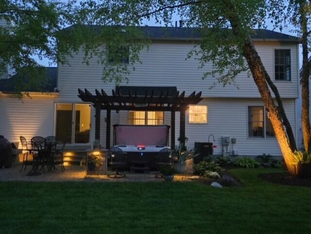 670 Mill Wood Blvd, Marysville, OH 43040 - rear view of house with a yard, a pergola, and a patio