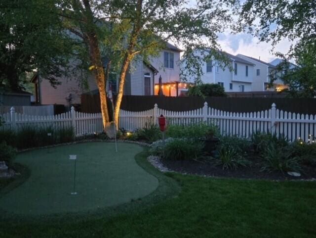 670 Mill Wood Blvd, Marysville, OH 43040 - view of yard with a putting green and fence