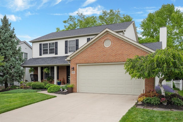 670 Mill Wood Blvd, Marysville, OH 43040 - traditional-style house featuring brick siding, a garage, concrete driveway, and a chimney