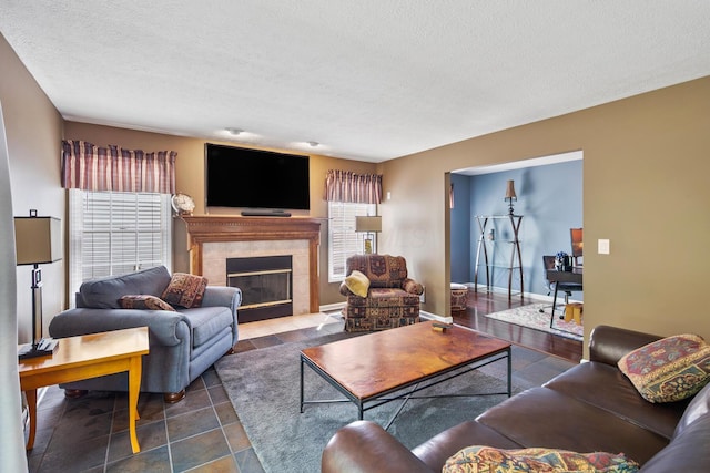 670 Mill Wood Blvd, Marysville, OH 43040 - living room featuring a high end fireplace and a textured ceiling