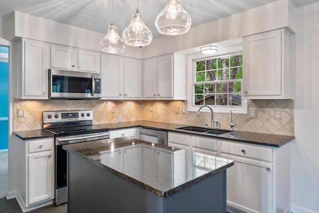 670 Mill Wood Blvd, Marysville, OH 43040 - kitchen with appliances with stainless steel finishes, a sink, and white cabinets