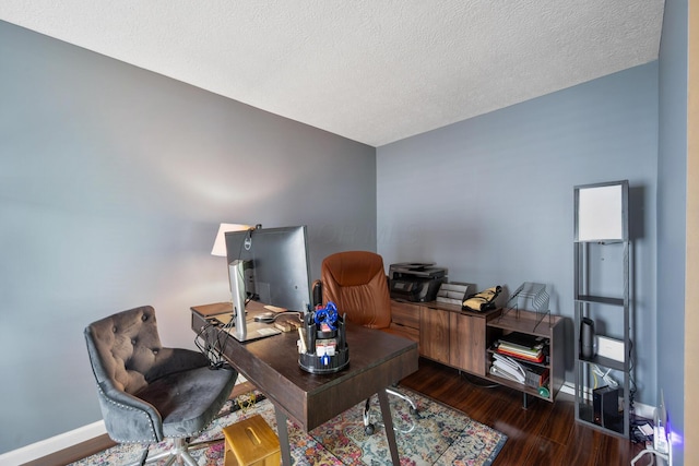 670 Mill Wood Blvd, Marysville, OH 43040 - home office featuring wood finished floors, baseboards, and a textured ceiling