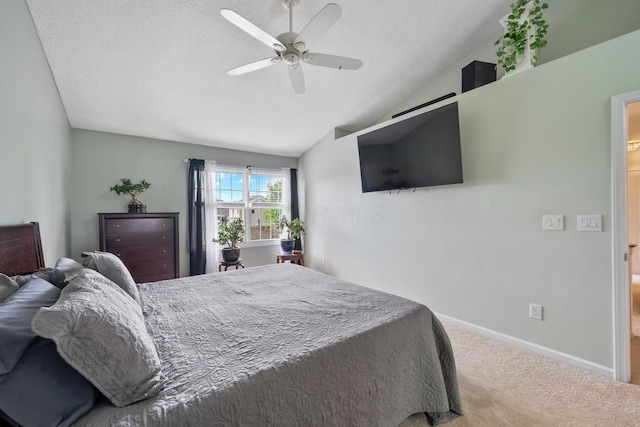 670 Mill Wood Blvd, Marysville, OH 43040 - carpeted bedroom with vaulted ceiling, a textured ceiling, a ceiling fan, and baseboards