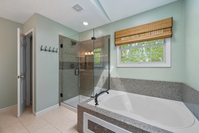 670 Mill Wood Blvd, Marysville, OH 43040 - full bathroom with a garden tub, a stall shower, tile patterned flooring, baseboards, and recessed lighting