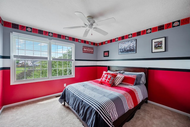 670 Mill Wood Blvd, Marysville, OH 43040 - carpeted bedroom featuring baseboards, ceiling fan, and a textured ceiling