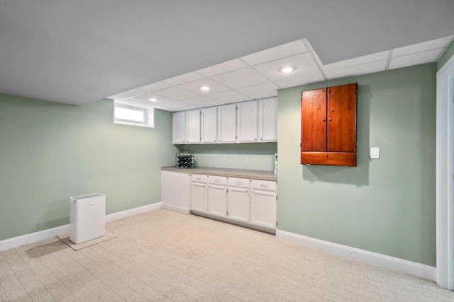 670 Mill Wood Blvd, Marysville, OH 43040 - below grade area with light colored carpet, baseboards, recessed lighting, and a paneled ceiling