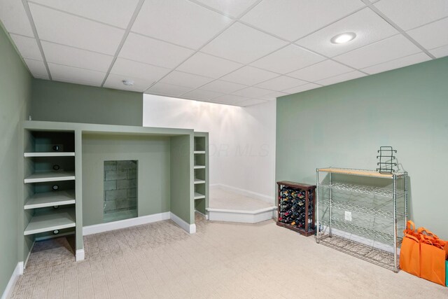 670 Mill Wood Blvd, Marysville, OH 43040 - unfurnished living room featuring carpet, baseboards, and a drop ceiling