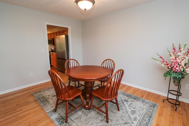 7553 Indian Creek Way, Powell, OH 43065 - dining space with baseboards and light wood-style flooring
