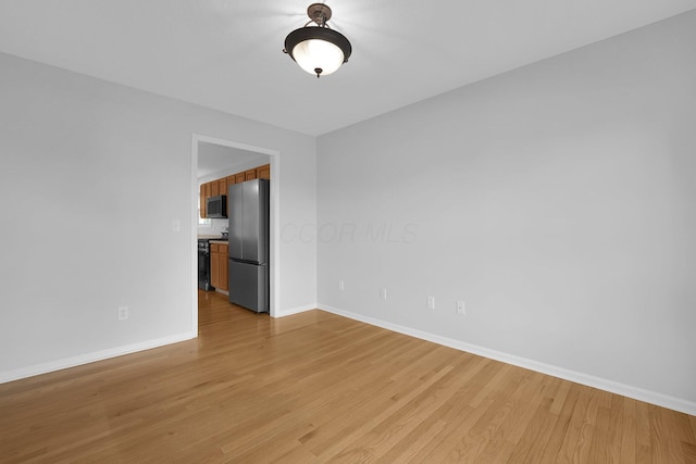 7553 Indian Creek Way, Powell, OH 43065 - empty room with light wood-type flooring and baseboards
