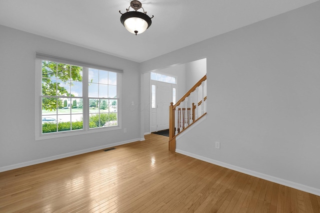 7553 Indian Creek Way, Powell, OH 43065 - spare room with stairway and light wood-type flooring