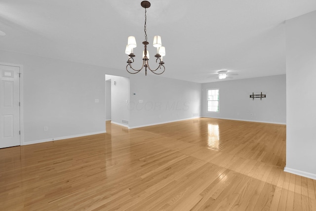 7553 Indian Creek Way, Powell, OH 43065 - unfurnished room with a chandelier, light wood-type flooring, and ceiling fan