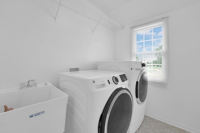 7553 Indian Creek Way, Powell, OH 43065 - laundry room with washer and clothes dryer and baseboards
