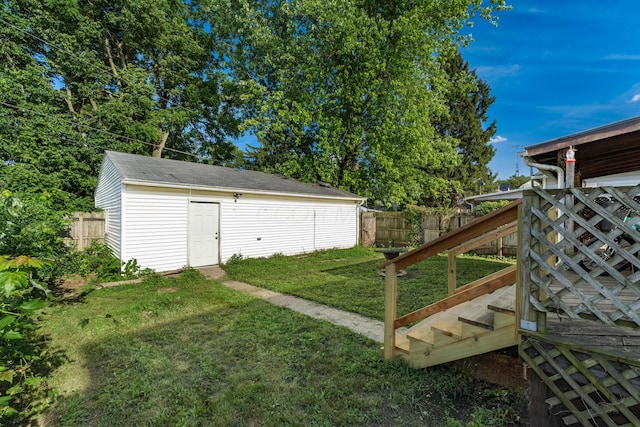 626 Evans St, Newark, OH 43055 - fenced backyard featuring stairway and an outbuilding