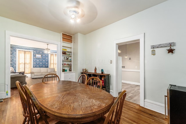 626 Evans St, Newark, OH 43055 - dining space featuring ceiling fan, wood finished floors, and beverage cooler