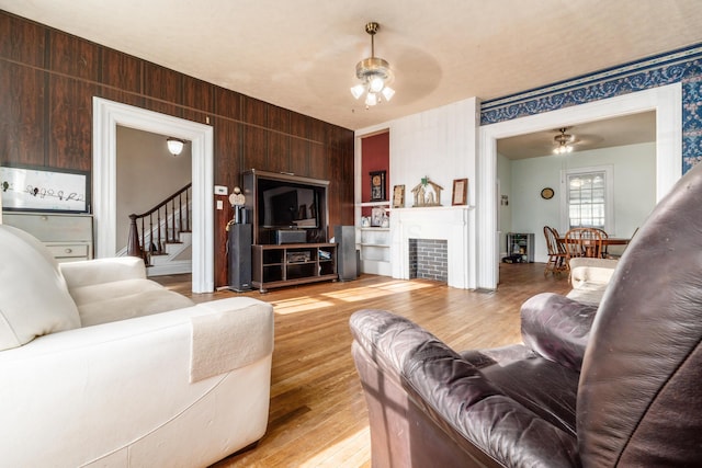 626 Evans St, Newark, OH 43055 - living room with ceiling fan, hardwood / wood-style floors, stairs, and a fireplace