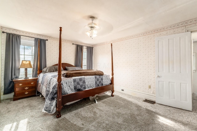 626 Evans St, Newark, OH 43055 - bedroom with wallpapered walls, carpet floors, and ceiling fan
