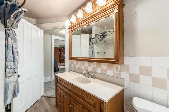 626 Evans St, Newark, OH 43055 - full bathroom with vanity, wood finished floors, and a shower