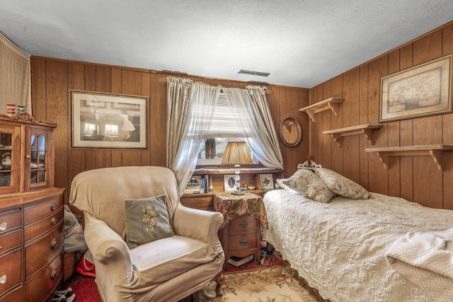 3951 Ivorton Rd W, Columbus, OH 43207 - bedroom featuring wood walls and visible vents