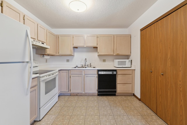 kitchen with light brown cabinetry, under cabinet range hood, white appliances, a sink, and light countertops