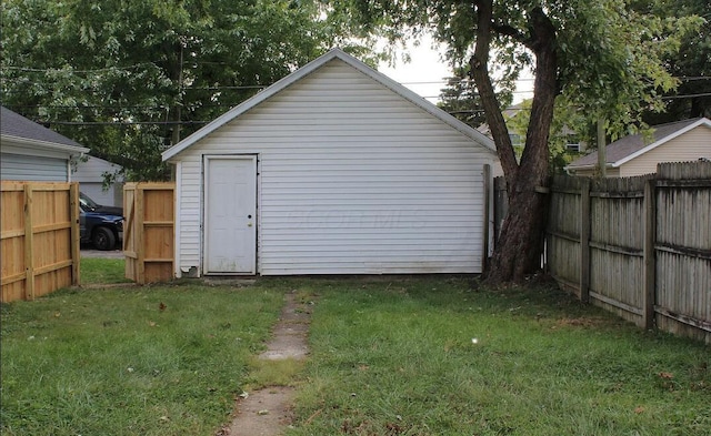 view of outbuilding featuring a fenced backyard and an outdoor structure