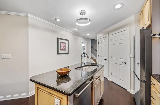 kitchen featuring a sink, dark wood-style flooring, ornamental molding, and appliances with stainless steel finishes