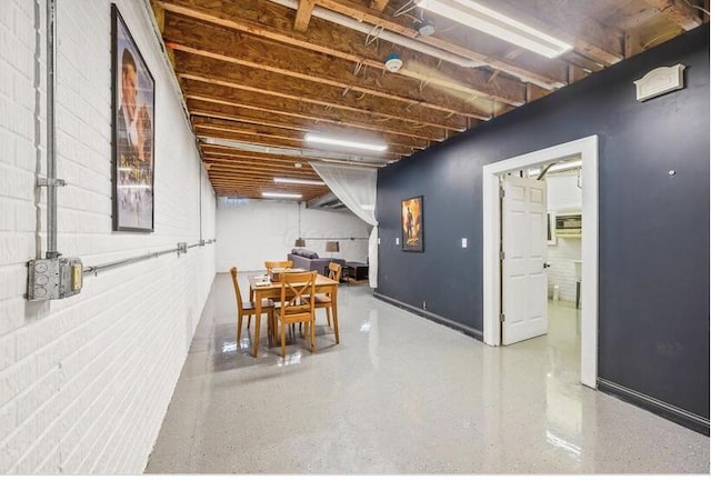 dining space with speckled floor