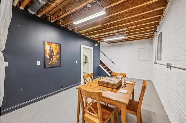 dining area featuring stairway