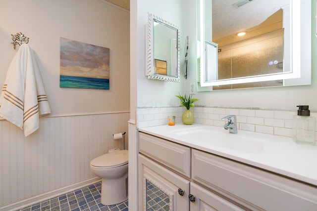 1225 Eastview Ave, Columbus, OH 43212 - bathroom with a wainscoted wall, toilet, vanity, and tile patterned flooring