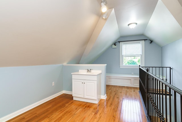 1225 Eastview Ave, Columbus, OH 43212 - bonus room featuring light wood finished floors, a sink, and vaulted ceiling