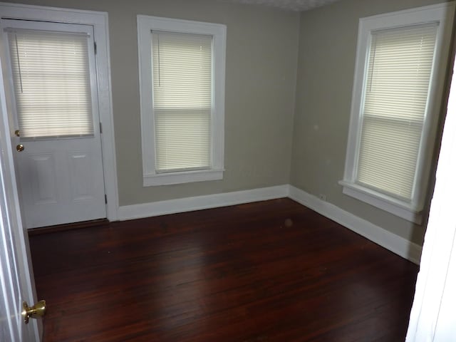 201 N Warren Ave, Columbus, OH 43204 - unfurnished room with dark wood-type flooring and baseboards