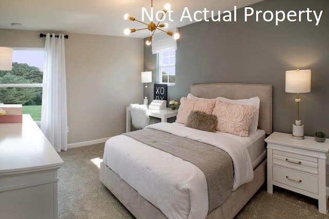 bedroom with an inviting chandelier, light carpet, and baseboards