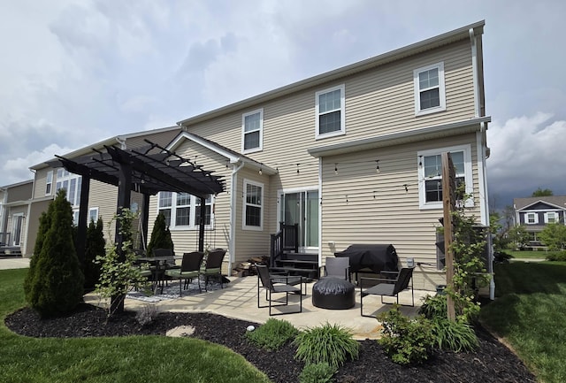 back of property featuring a patio area, a pergola, and entry steps