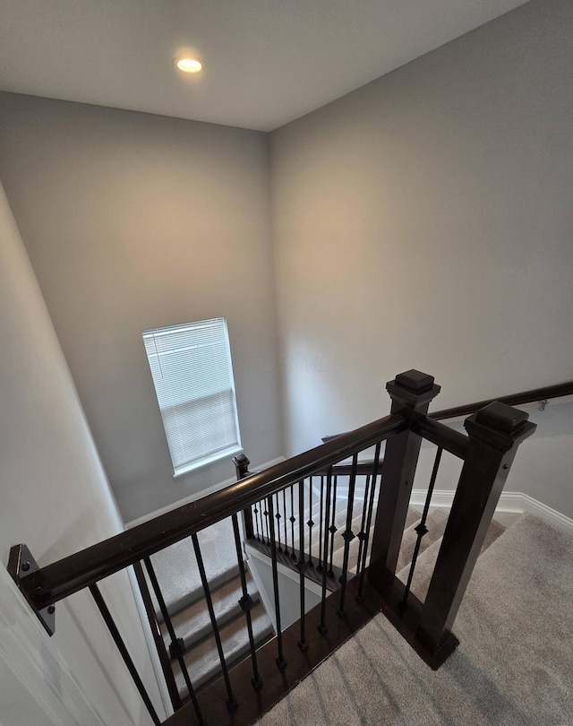 stairs featuring carpet, baseboards, and recessed lighting