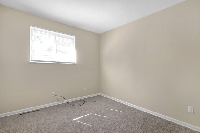 3935 Hillman Rd W, Columbus, OH 43207 - empty room with baseboards, carpet flooring, and visible vents