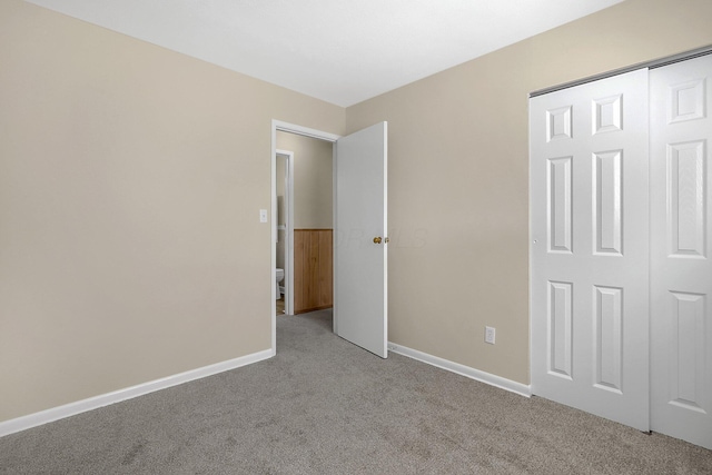 3935 Hillman Rd W, Columbus, OH 43207 - unfurnished bedroom featuring a closet, baseboards, and carpet floors