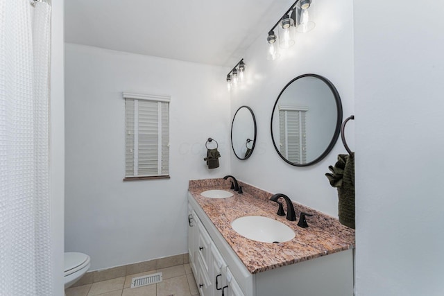 2101 Eastcleft Dr, Upper Arlington, OH 43221 - full bathroom featuring a sink, toilet, visible vents, tile patterned floors, and double vanity