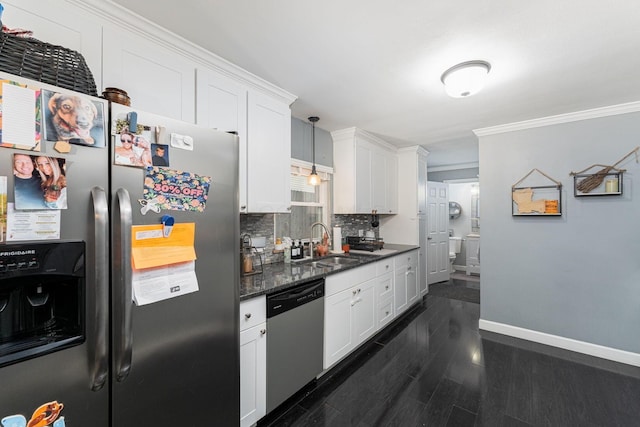 2101 Eastcleft Dr, Upper Arlington, OH 43221 - kitchen featuring a sink, white cabinets, dark wood finished floors, appliances with stainless steel finishes, and decorative backsplash