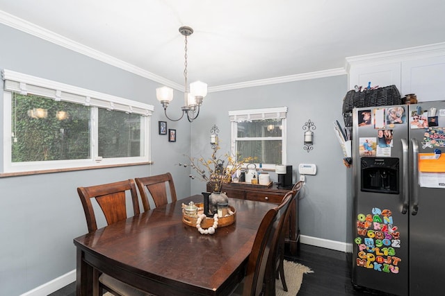 2101 Eastcleft Dr, Upper Arlington, OH 43221 - dining area featuring crown molding, dark wood finished floors, baseboards, and an inviting chandelier