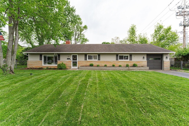 2101 Eastcleft Dr, Upper Arlington, OH 43221 - ranch-style house with fence, brick siding, driveway, a garage, and a chimney