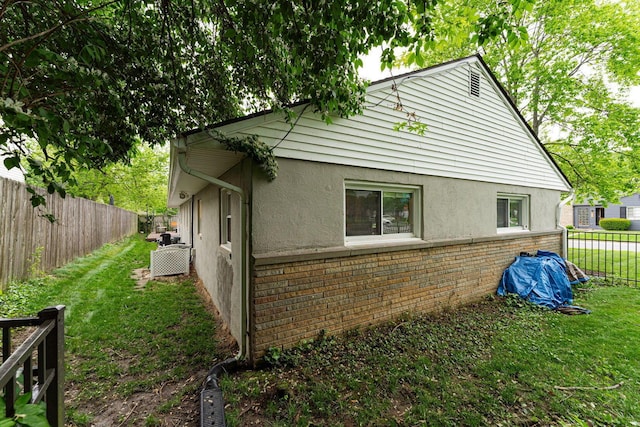 2101 Eastcleft Dr, Upper Arlington, OH 43221 - view of property exterior with a yard, brick siding, stucco siding, and fence private yard