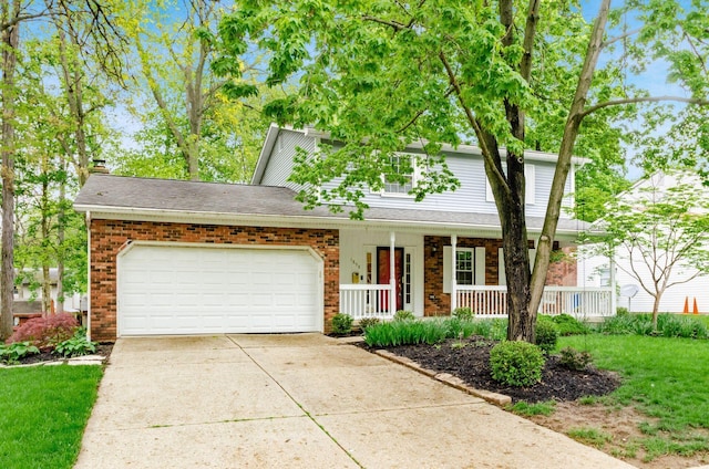 traditional-style home featuring a porch, a garage, brick siding, and driveway