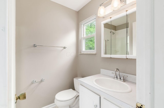 full bathroom with toilet, walk in shower, and vanity