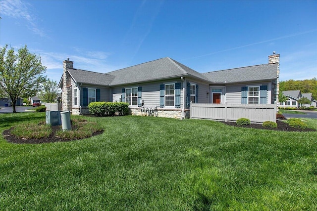 6227 Stonewalk Ln, New Albany, OH 43054 - view of front of house with stone siding, a front lawn, and a chimney