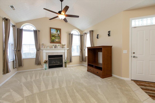 6227 Stonewalk Ln, New Albany, OH 43054 - unfurnished living room featuring a ceiling fan, visible vents, plenty of natural light, and vaulted ceiling
