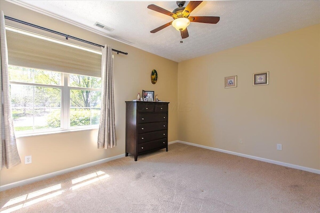 6227 Stonewalk Ln, New Albany, OH 43054 - bedroom with a textured ceiling, baseboards, ceiling fan, visible vents, and light colored carpet