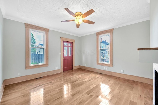 661-663 Beech St, Columbus, OH 43206 - foyer with light wood-style floors, a ceiling fan, baseboards, and crown molding