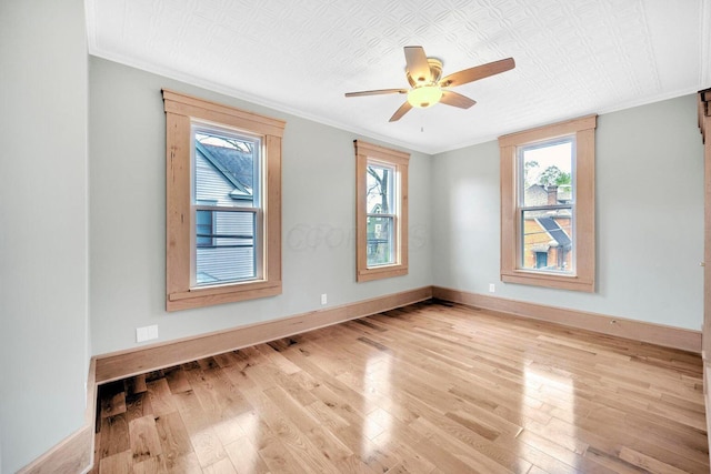 661-663 Beech St, Columbus, OH 43206 - empty room with wood finished floors, ornamental molding, baseboards, ceiling fan, and an ornate ceiling